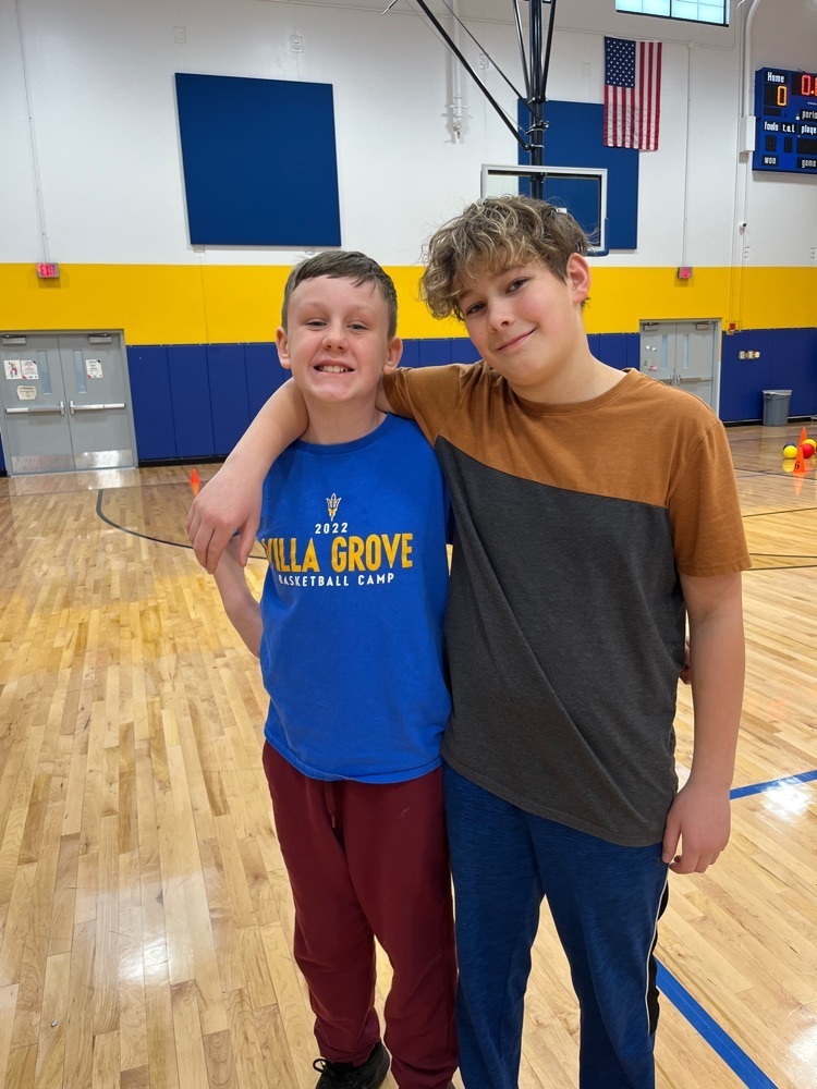 PE Teacher of the Day, Isaiah; with his assistant, Avery.